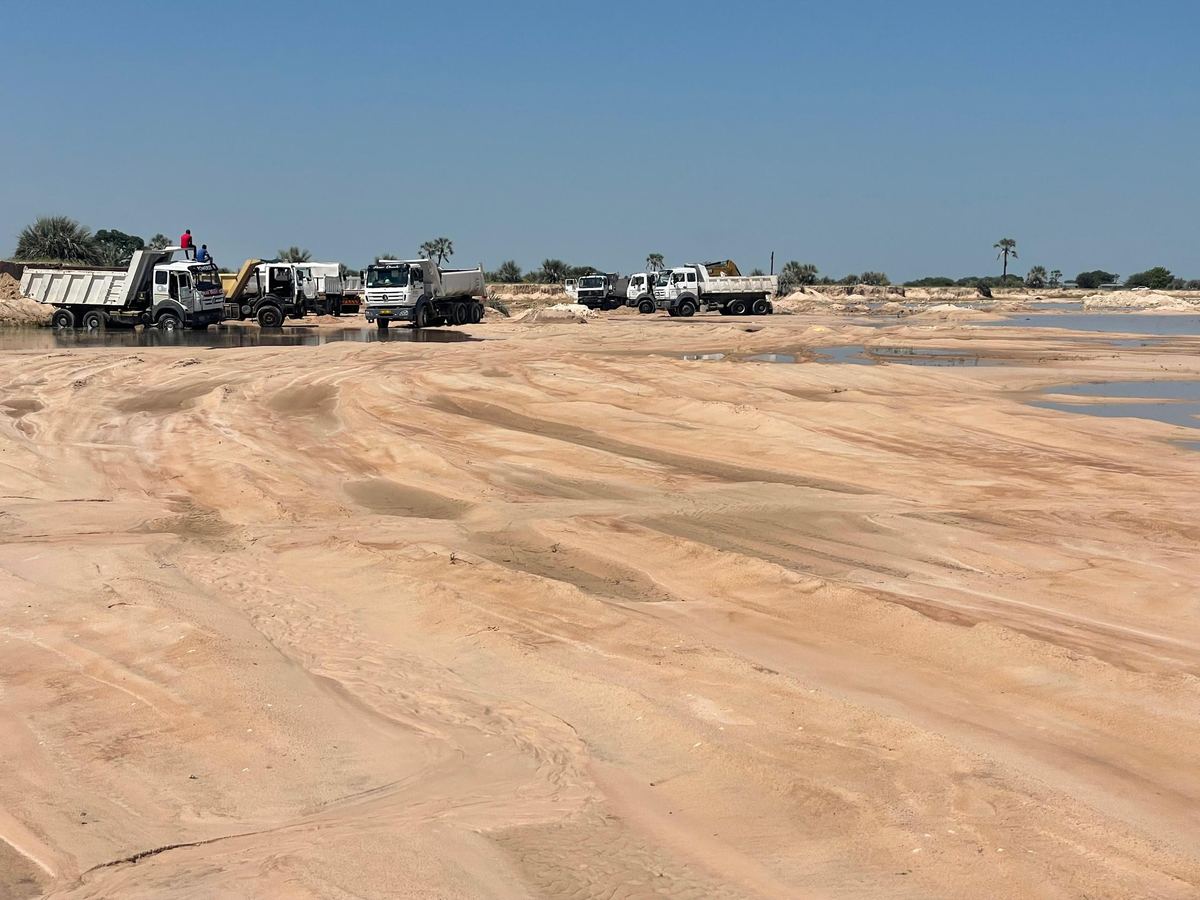 Okongo market construction, dump trucks on site